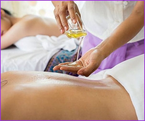 Peaceful Thai woman receiving traditional treatment